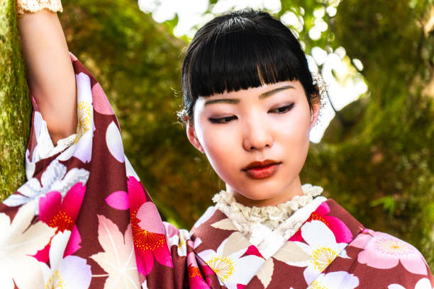 A woman in a kimono posing