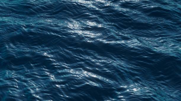 istock 3d render, abstract background of a tranquil and deep blue water surface, with gentle ripples catching the light, conveying a sense of calm and depth. Wallpaper of wavy sea surface 2176673364