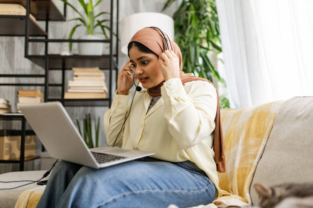 istock Focused woman setting up for online video call 2176673638