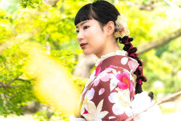 istock A woman in a kimono walking around town 2176674320