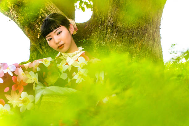 A woman in a kimono posing