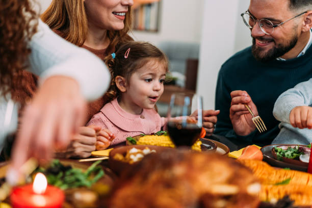 istock Happy extended family celebrating Thanksgiving at dining table. 2176675594