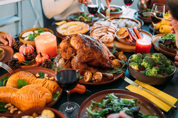 istock Happy family celebrating Thanksgiving at dining table. 2176675618