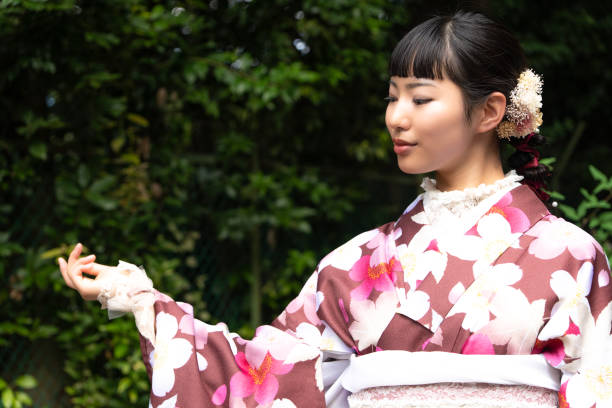 istock A woman in a kimono walking around town 2176676230