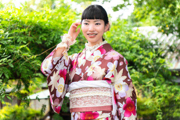 istock A woman in a kimono walking around town 2176676317