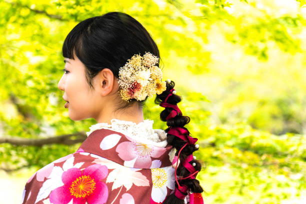 istock A woman in a kimono walking around town 2176677879