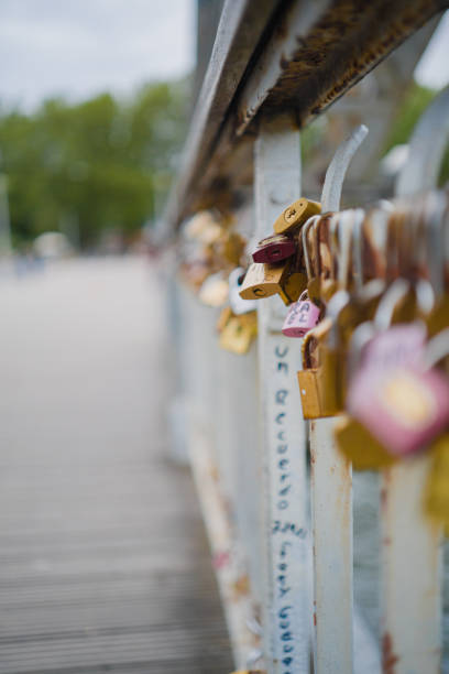 Padlock Hanging on the Railing of the Bridge Close Up Represeting Love