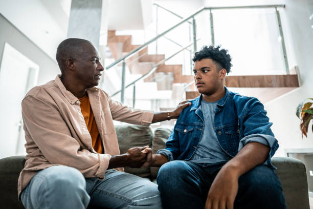 istock Father talking to his to son at home 2176683711