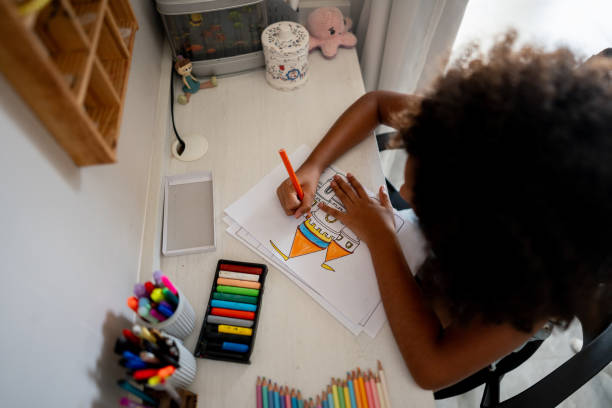 istock Girl drawing at home 2176684240