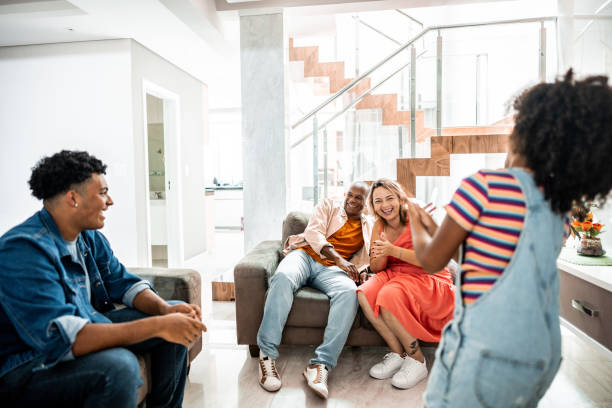 istock Family playing charades at home 2176685431