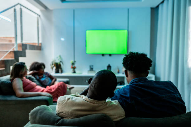 istock Family watching TV at home 2176685609