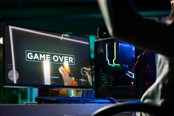 istock Annoyed man upset after losing while playing FPS videogame, failing to win 2176685882