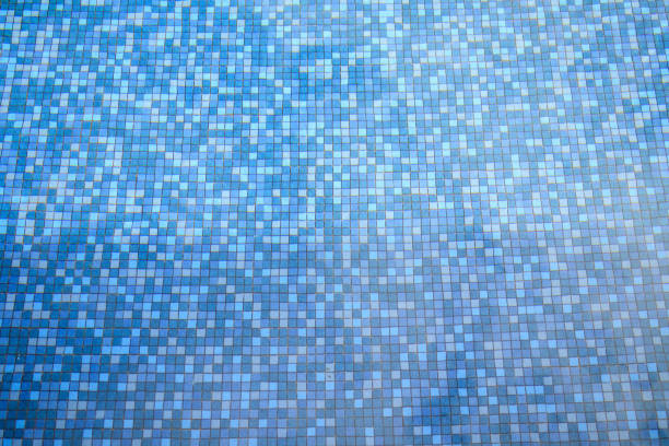 Swimming pool water surface and ripple wave with blue mosaic tiles