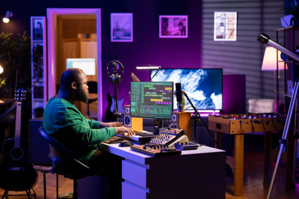 istock Producer composing a new track with electronic gear in his home studio 2176690008