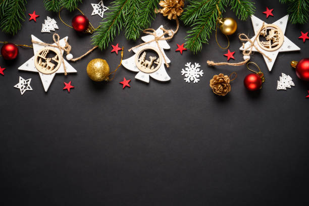 istock Christmas tree with holidays decorations at black background. 2176693009