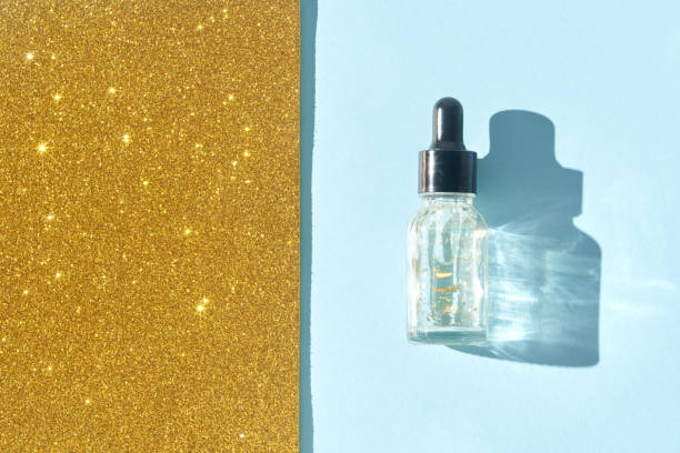 istock Serum gel texture swatch. Transparent drop with golden sparkles. 2176693176