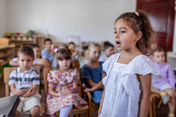 istock Young girl performing confidently in front of class. 2176693650