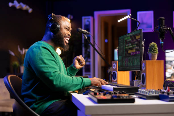 istock Confident sound designer adding piano notes on his music recordings 2176695510