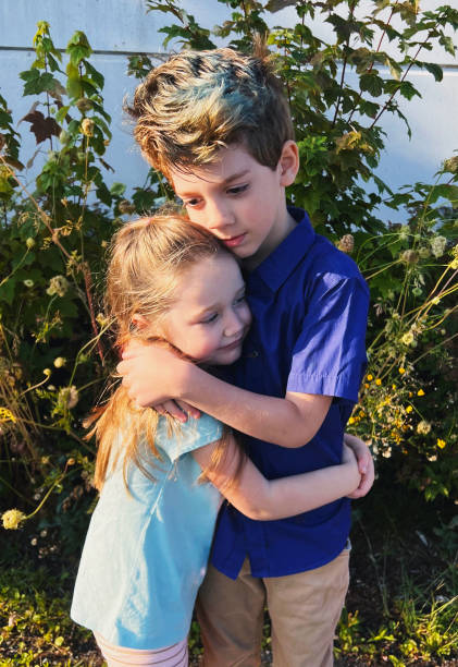istock Brother and Sister Hug 2176698029