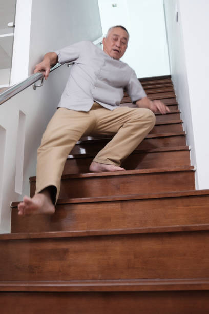 istock Elderly person slips and falls down stairs 2176698983