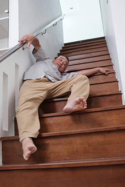 istock Elderly person slips and falls down stairs 2176698984