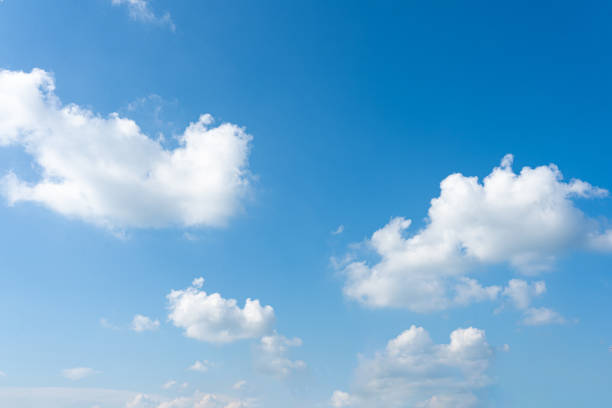 istock Fluffy white clouds drift across a vibrant blue sky, creating a breathtaking natural canvas 2176701778