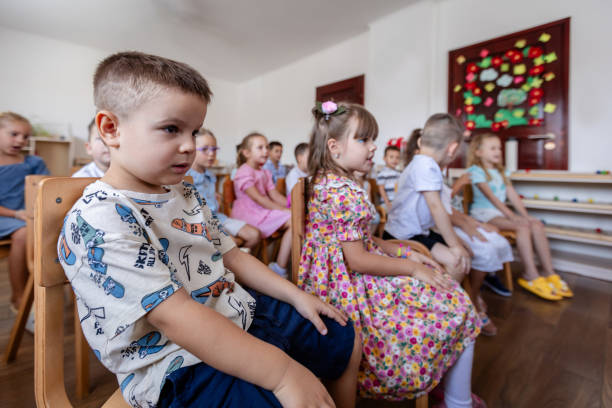 istock Children attentively listening in a classroom setting. 2176706548