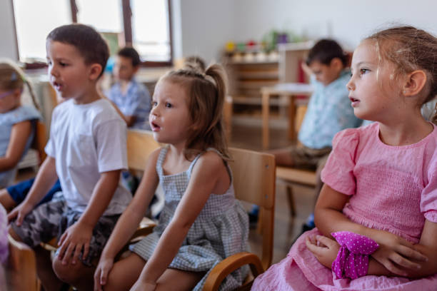 istock Attentive kids enjoying a learning moment in the class. 2176708346