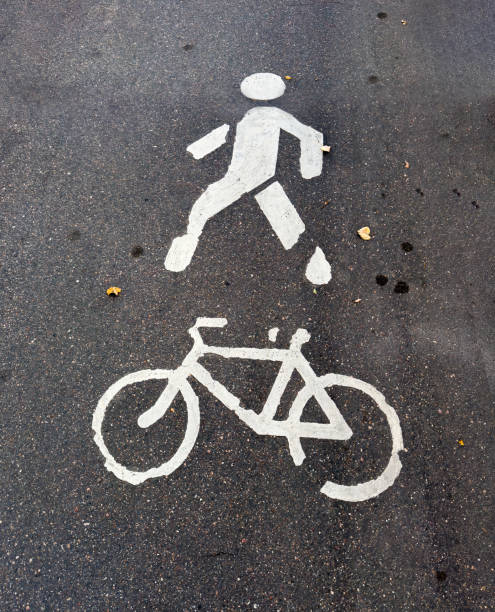 istock Pedestrian and bicycle lane markings on urban pathway 2176717182