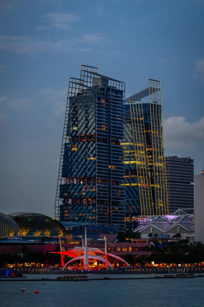 The View of South Beach Towers look from Marina bay during blue time in Singapore