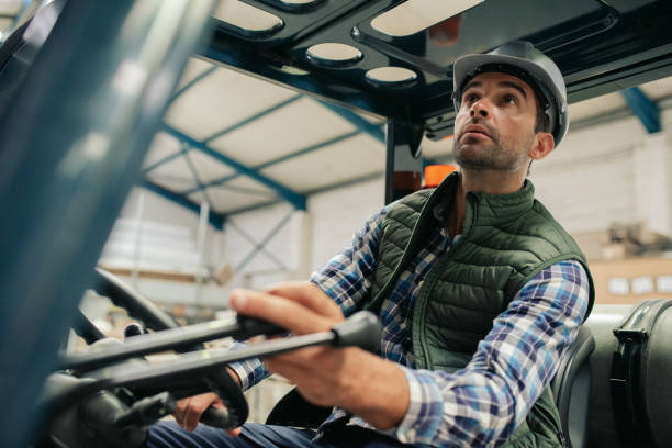 istock Forklift driver carefully moving stock around a warehouse floor 2176719844