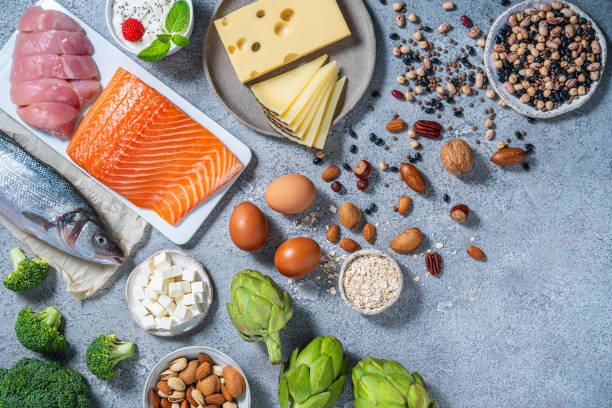 istock Assorted healthy protein source food good for body building: fish, meat, cheese, beans, eggs. 2176721629