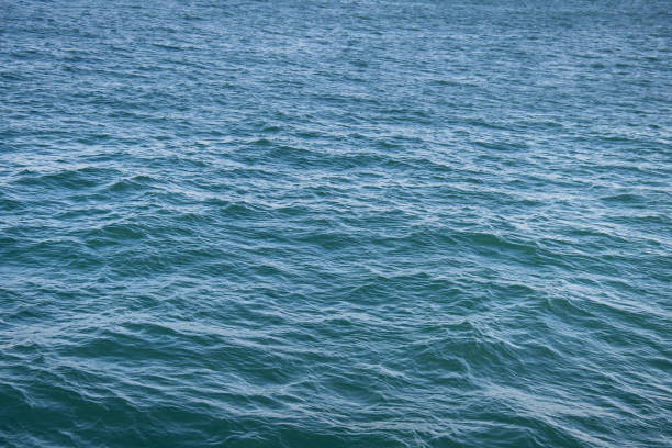 istock waves on the sea surface. Blue water asbstract. 2176723011