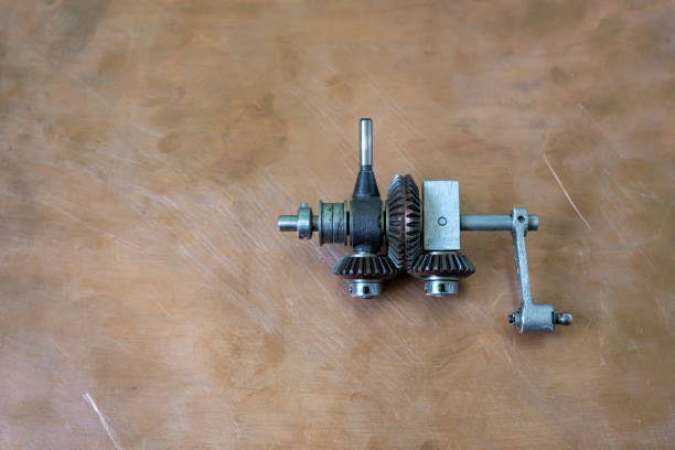 A mechanical device used in mechanical engineering and aircraft construction. Bevel gear, the differential, a copper surface, and copy space.