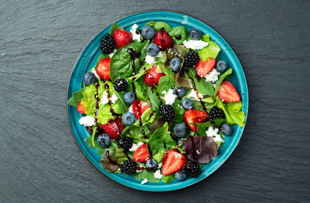 Berries salad (blueberry strawberry blackberry ) with cheese feta and balsamic sauce