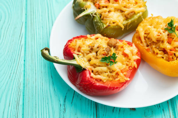 istock Baked stuffed pepper ( paprika ) with rice , carrot and meat . Top view on rustic background 2176732379