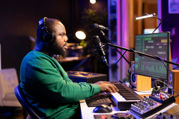 istock Young songwriter playing piano and singing on microphone 2176732598