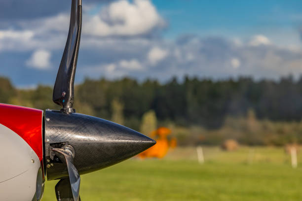 Ultralight planes flying low over a grassy airport