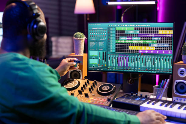 istock Music producer inserting an usb stick to copy and edit audio recordings 2176733995