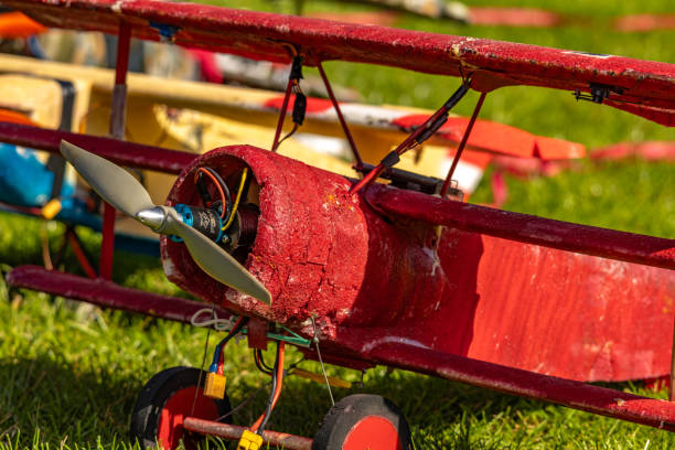 istock Ultralight planes flying low over a grassy airport 2176734026