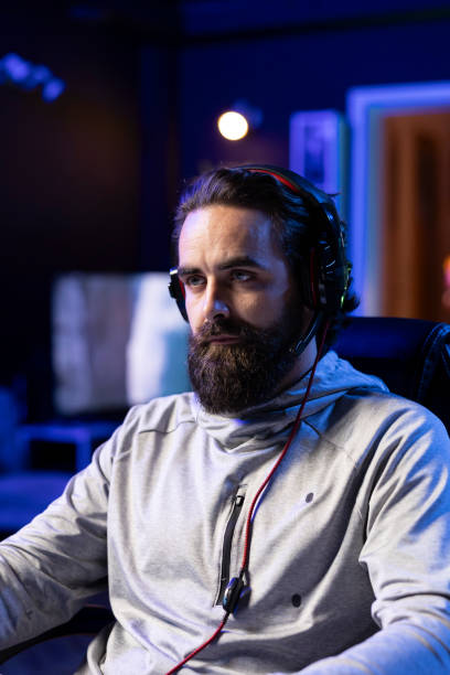 istock Gamer streaming, greeting audience, preparing to showcase gameplay 2176734463
