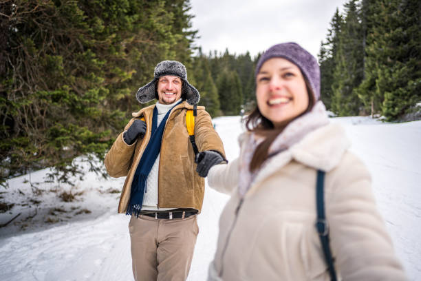 istock Couple having fun in a snowy mountain 2176734863