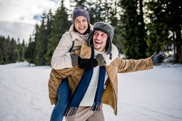 istock Piggy back fun in the snow 2176735450