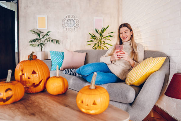 istock Woman enjoy at home while preparing Halloween 2176741589