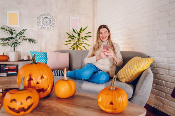 istock Woman enjoy at home while preparing Halloween 2176741894