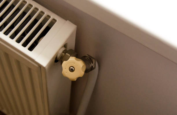 istock Battery heating knob. Heating in an apartment, at home. Heating prices. 2176750494