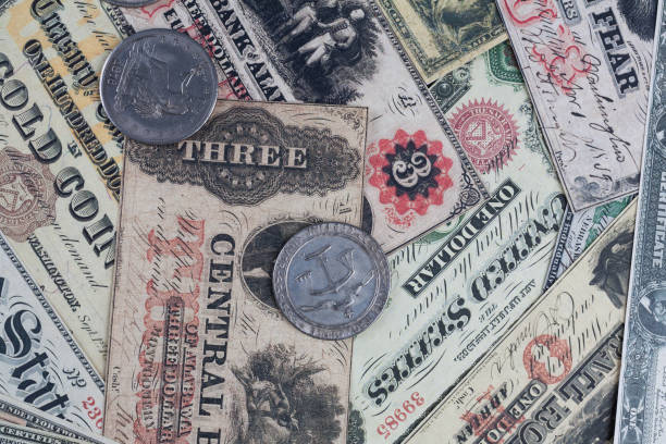 istock Old west US banknotes and silver certificates with silver dollar coins 2176751558
