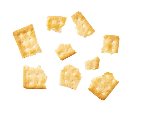 istock Broken square water crackers isolated on white background, top view. 2176753141