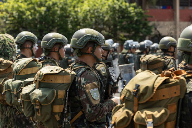 Peru, Cusco-March 14,2025:  Security personnel maintain order and ensure safety amid the bustling activity in Cusco’s Plaza de Armas