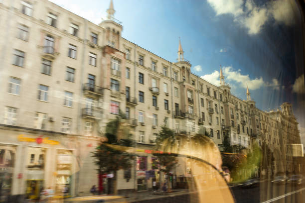 Moscow, Russia - 25, August, 2024.\nBus tour of interesting places and streets of Moscow.\nWe drive past a residential building with turrets.